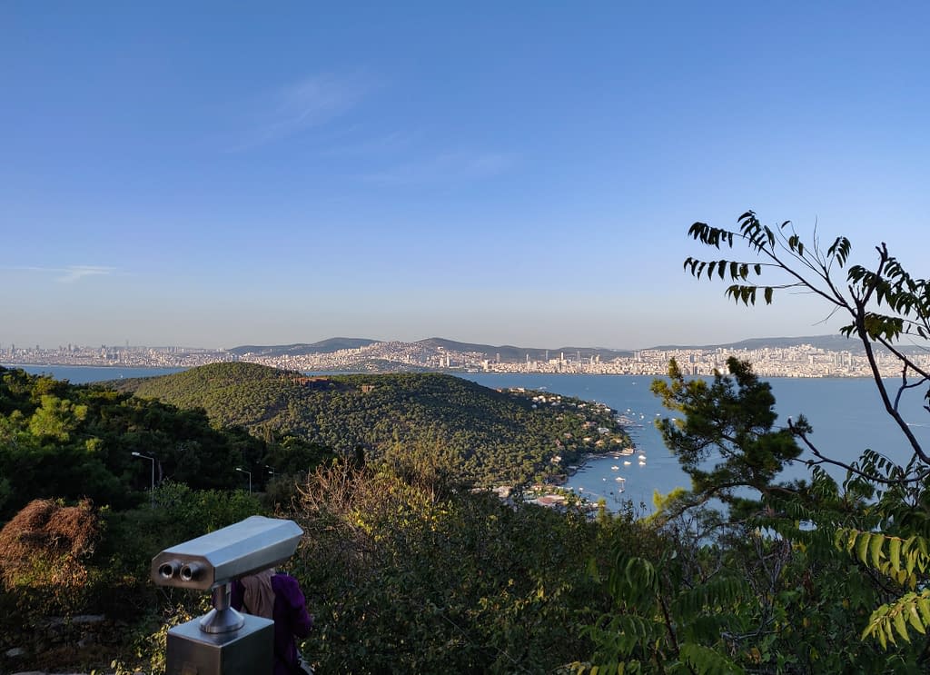 The view from the mountain of Aya Yorgi Church (Aya Yorgi Kilisesi) on Büyükada in Istanbul. The second green mountain in the front is on the same island of Büyükada. In the background you see the Asian side of Istanbul.