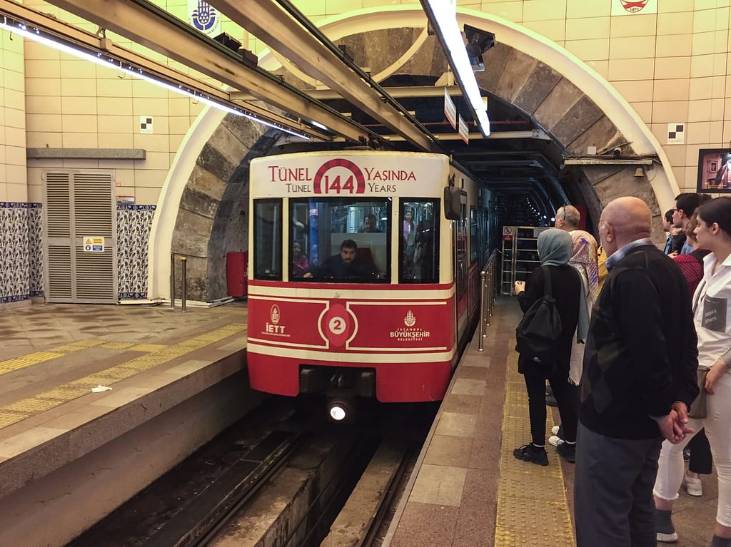 The Tünel (F2 line) is a historic subway funicular line in Istanbul, located on the southeastern shore of the Golden Horn. It has two stations, connecting the areas of Karaköy and Beyoğlu. Its tunnel goes uphill from close to sea level and is about 573 metres long. The Tünel, which entered service in 1875, is the world's second-oldest underground urban rail line.